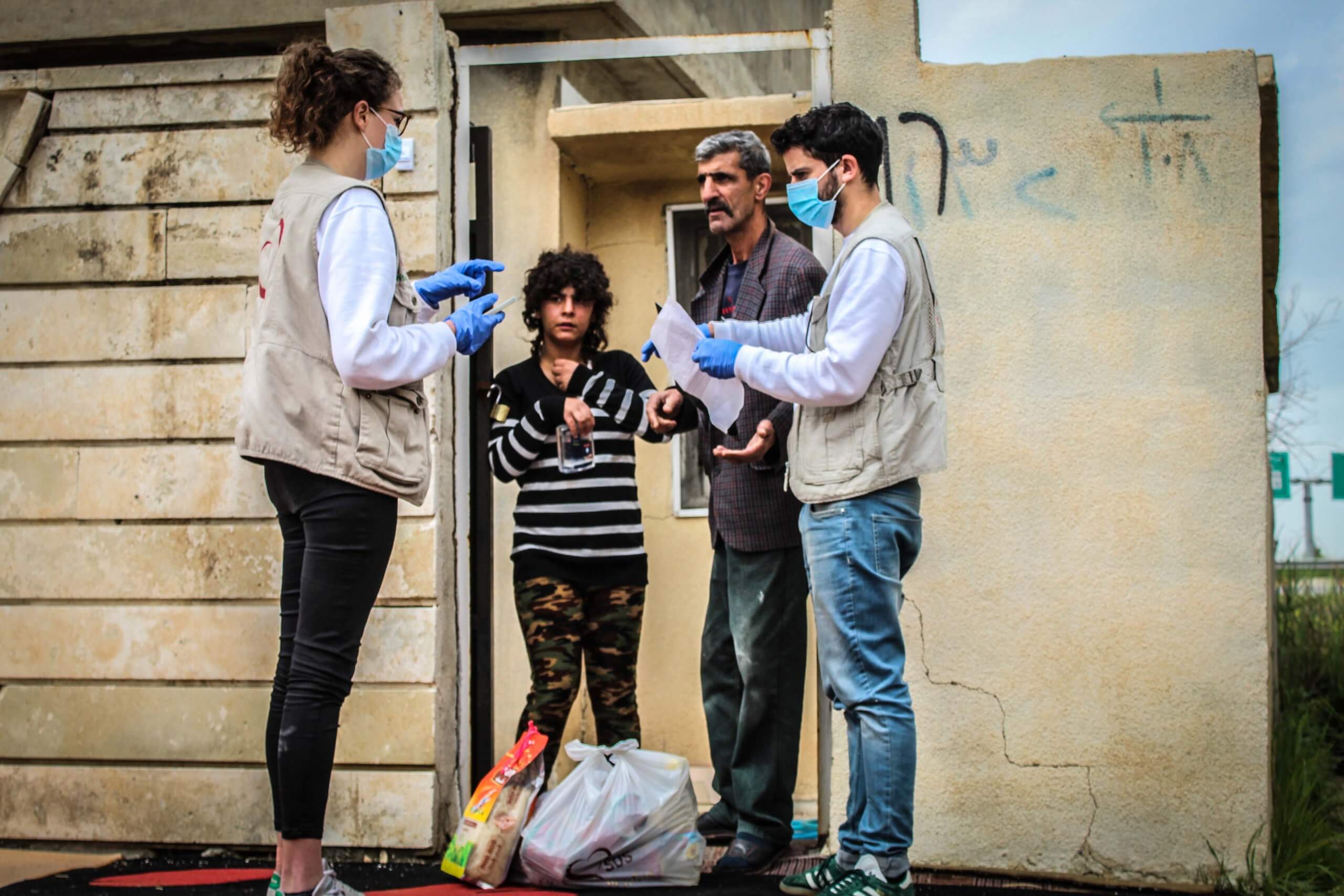 A team of volunteers distributes emergency packes to combat the coronavirus to 89 poor Iraqi families